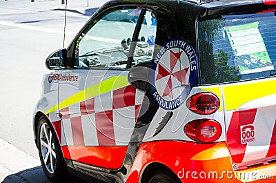 Little NSW Ambulance smart car parking on downtown street of Sydney. Editorial Stock Photo